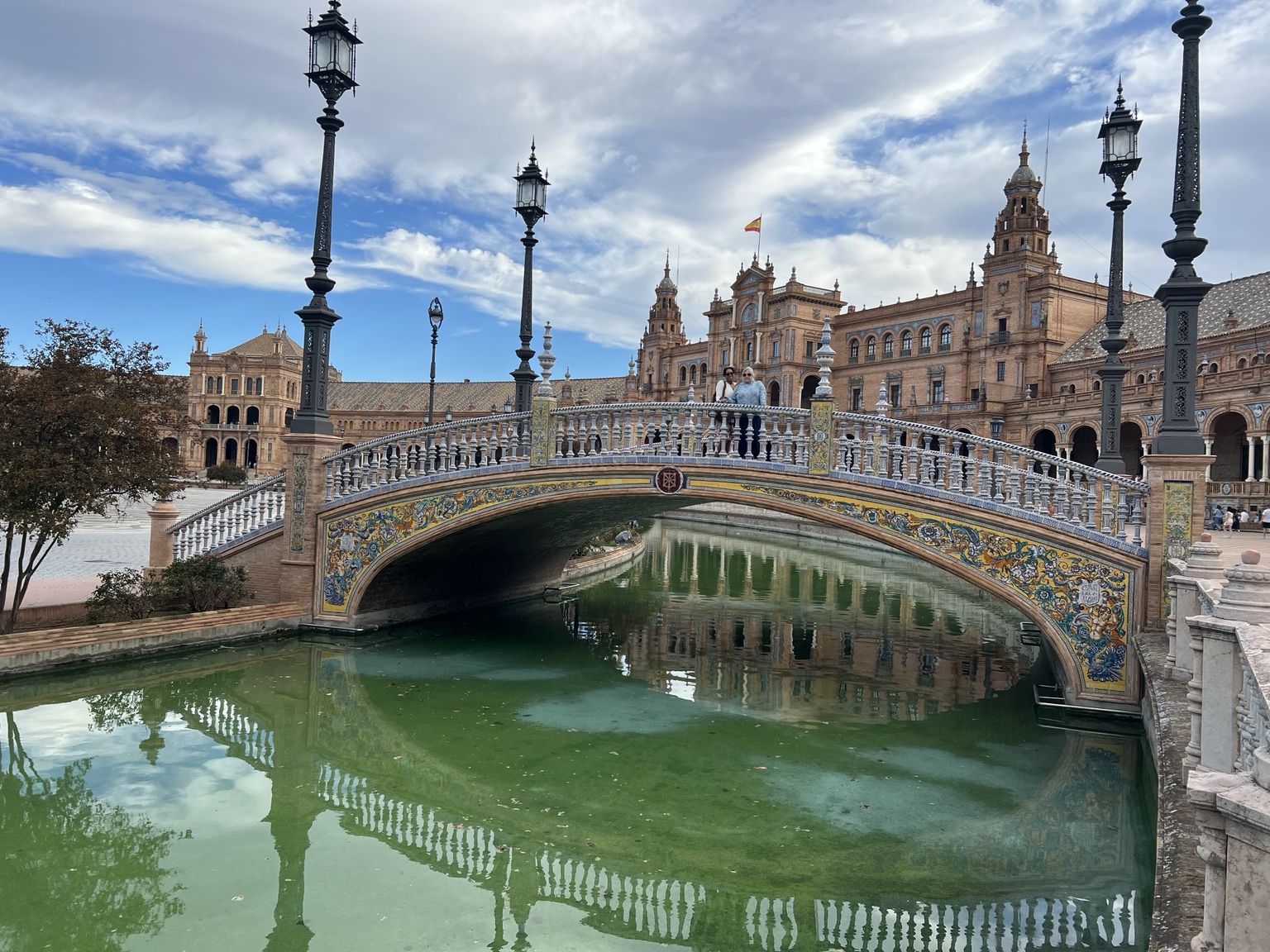 Ornate tiled bridge over the canal at Plaza de España in Seville